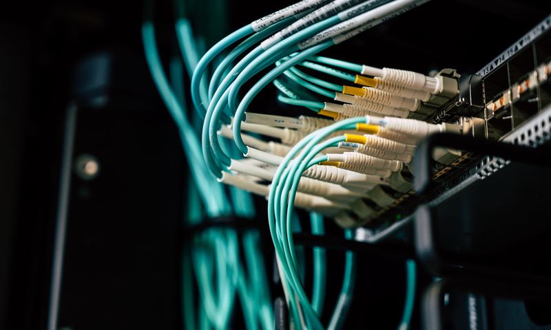 Fiber-optic cables connected to network equipment